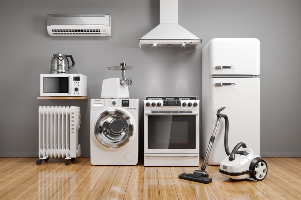 Set Of Home Kitchen Appliances In The Room On The Wall Background.